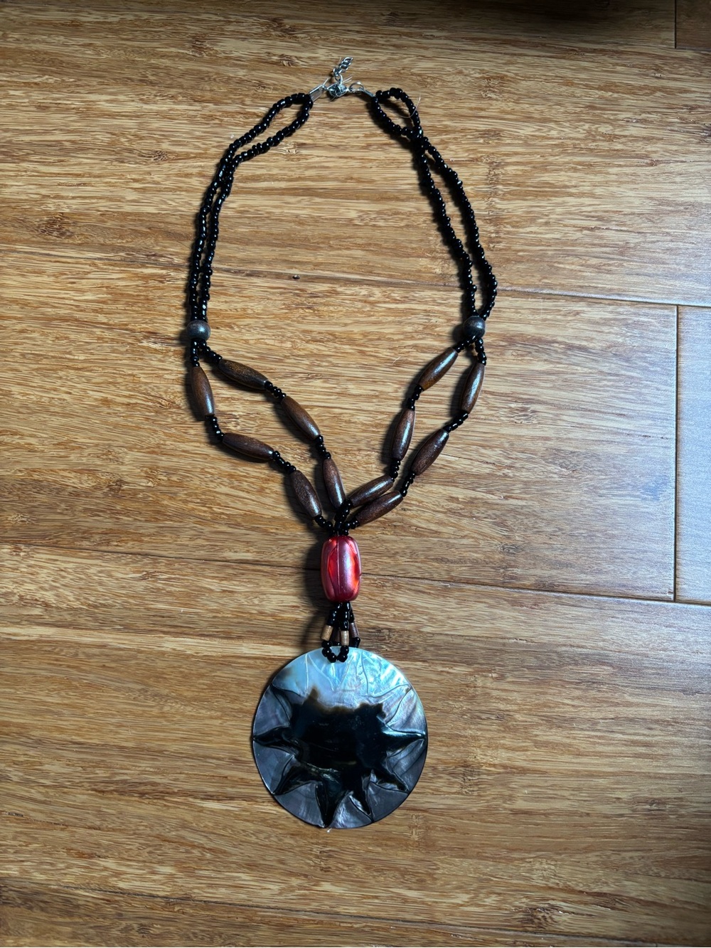 Beaded Black and Brown Pendant Necklace with Red Accent